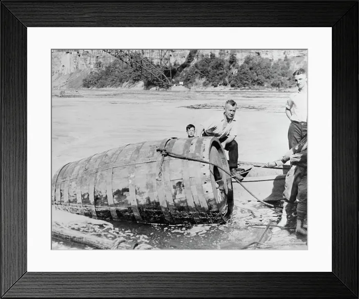 Framed Print : Men Pulling Large Death Barrel from Water Framed Print : Men Pulling Large Death Barrel from Water