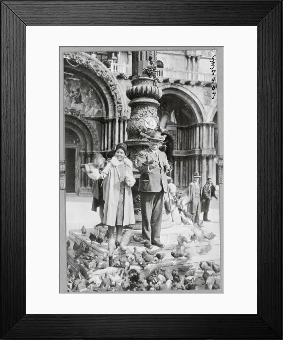 Framed Print : Elderly Couple Surrounded by Pigeons at Saint Marks