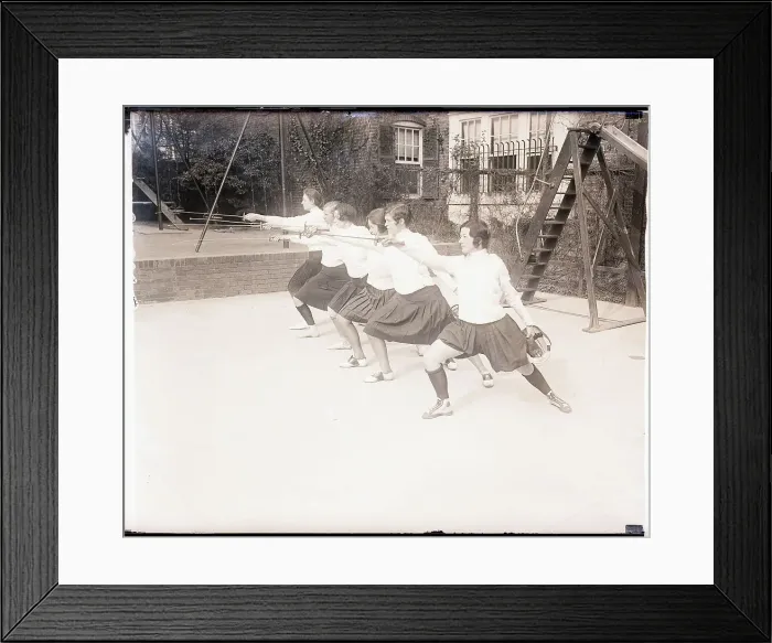 Framed Print : Fencing Debutantes Pose Lunging Framed Print : Fencing Debutantes Pose Lunging