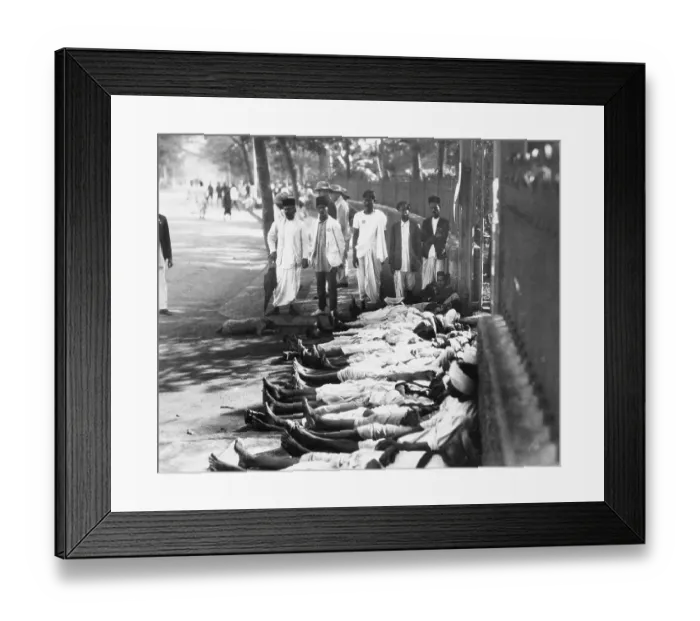 Framed Print : Workers in India Lie Prone in Front of Shop Framed Print : Workers in India Lie Prone in Front of Shop