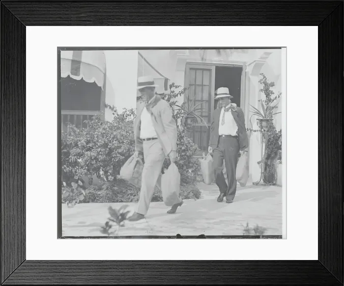 Framed Print : Law Enforcement Officers Carrying Bags from Al Capone's Home Framed Print : Law Enforcement Officers Carrying Bags from Al Capone's Home