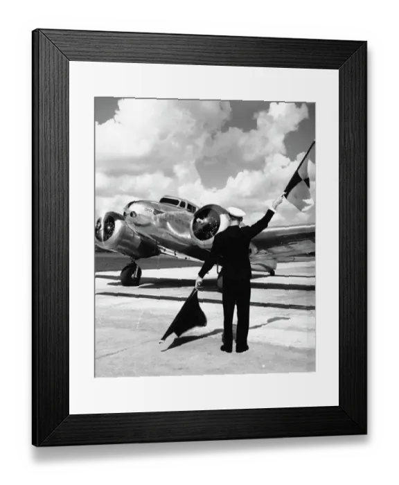 Framed Print : Worker Flagging in Airplane Framed Print : Worker Flagging in Airplane