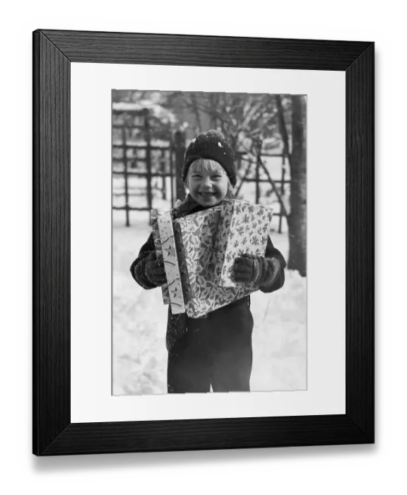 Framed Print : Child Holding Christmas Gifts