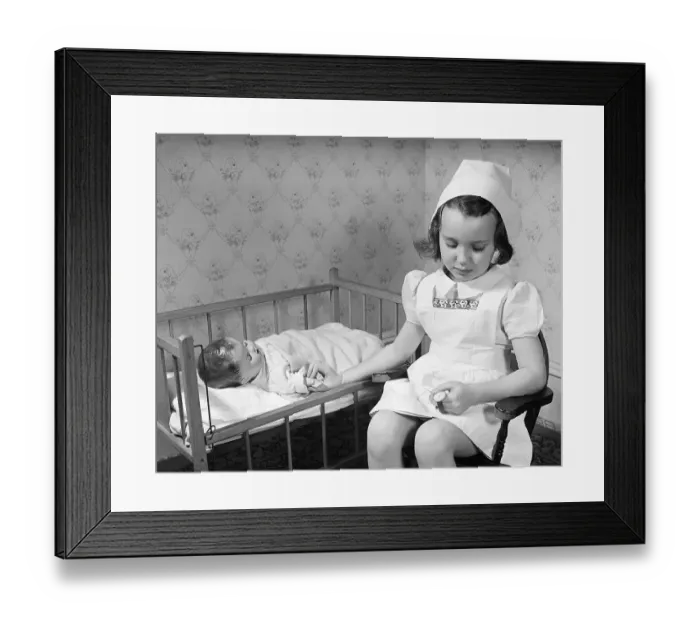 Framed Print : Little Girl Playing Nurse Framed Print : Little Girl Playing Nurse