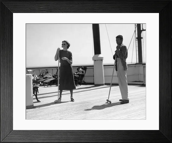 Framed Print : Man and Woman Playing Shuffleboard on a Ship Framed Print : Man and Woman Playing Shuffleboard on a Ship