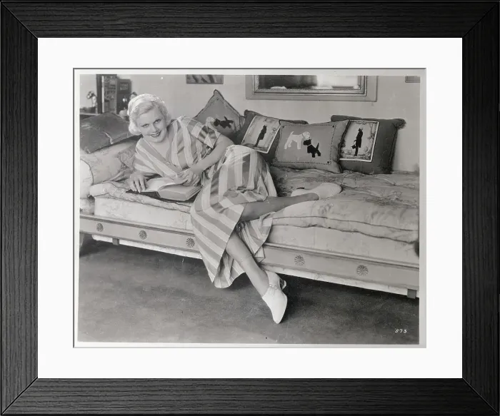 Framed Print : Actress Jean Harlow Reclining on a Sofa with Book Framed Print : Actress Jean Harlow Reclining on a Sofa with Book