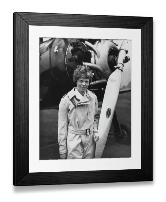 Framed Print : Aviatrix Amelia Earhart Posing by Airplane Framed Print : Aviatrix Amelia Earhart Posing by Airplane