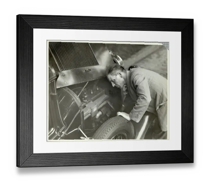 Framed Print : Man Inspecting Motor of Used Automobile Framed Print : Man Inspecting Motor of Used Automobile
