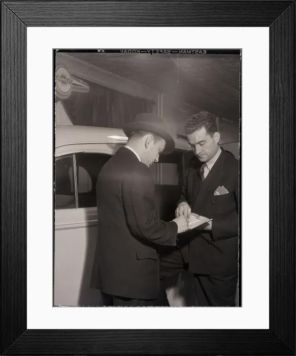 Framed Print : Man Signing Paper in Process Framed Print : Man Signing Paper in Process
