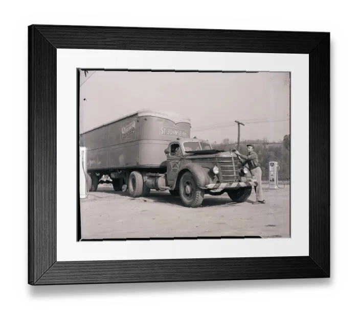 Framed Print : Man Servicing Truck at Gas Station Framed Print : Man Servicing Truck at Gas Station