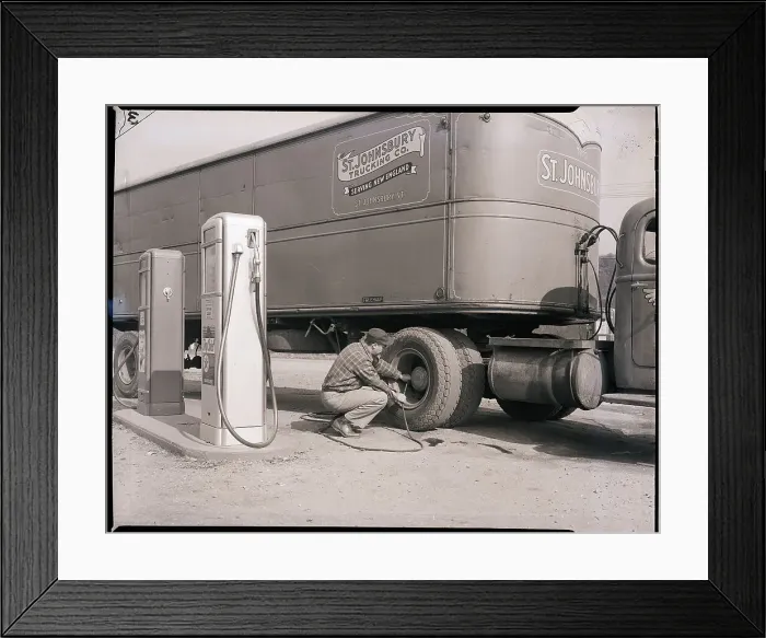 Framed Print : Man Servicing Truck at Gas Station
