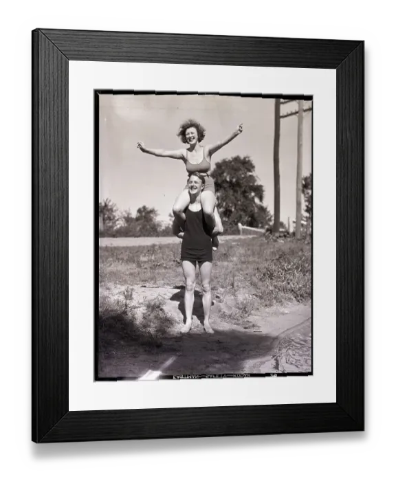 Framed Print : Woman Seated on Man's Shoulders Framed Print : Woman Seated on Man's Shoulders