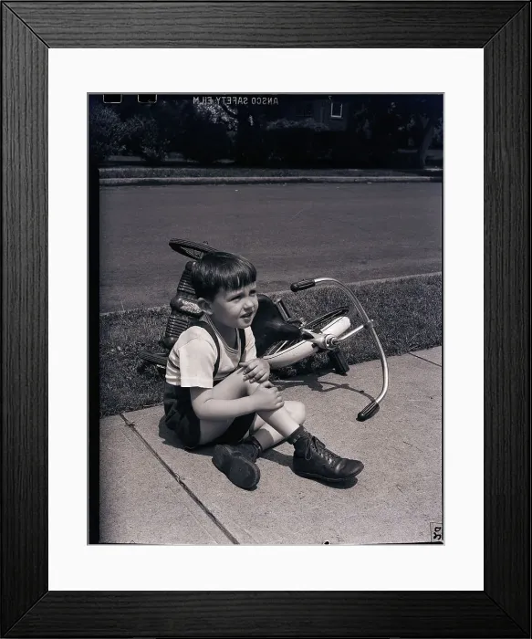 Framed Print : Boy Fallen Off Tricycle and Holding Knee Framed Print : Boy Fallen Off Tricycle and Holding Knee