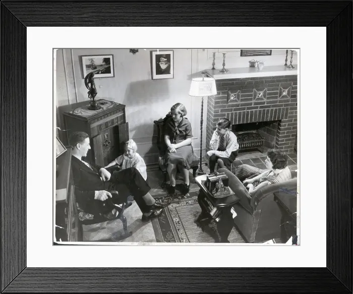 Framed Print : Family Seated in Living Room Around Radio Framed Print : Family Seated in Living Room Around Radio