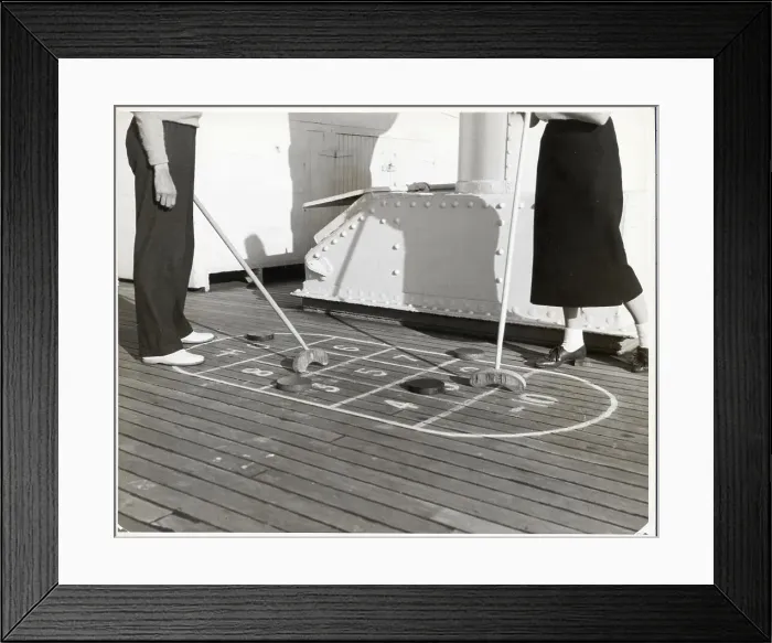 Framed Print : Couple Playing Shuffleboard Framed Print : Couple Playing Shuffleboard
