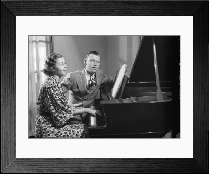 Framed Print : Young Couple Seated at Piano Framed Print : Young Couple Seated at Piano
