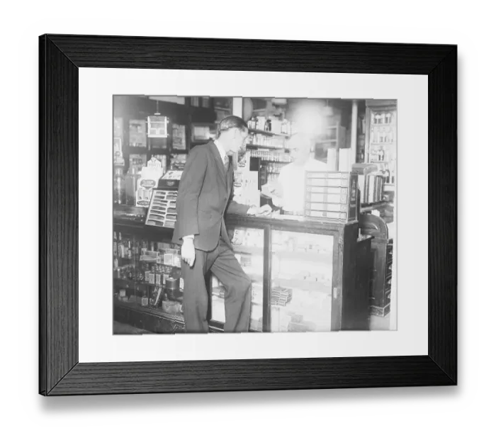 Framed Print : Customer Standing at Drug Store Counter Framed Print : Customer Standing at Drug Store Counter
