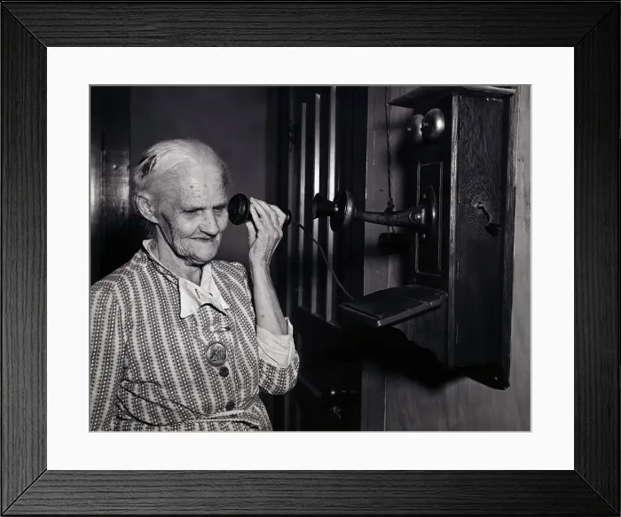 Framed Print : Woman Using Old-Fashioned Telephone Framed Print : Woman Using Old-Fashioned Telephone