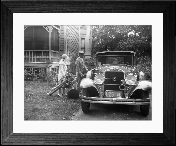 Framed Print : Couple Loading Baggage into Oldsmobile
