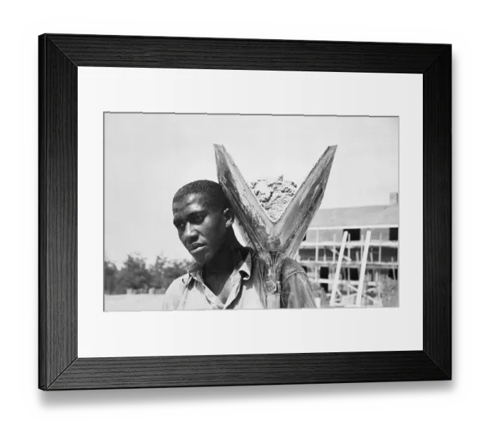 Framed Print : Man Carrying Concrete for Construction Framed Print : Man Carrying Concrete for Construction