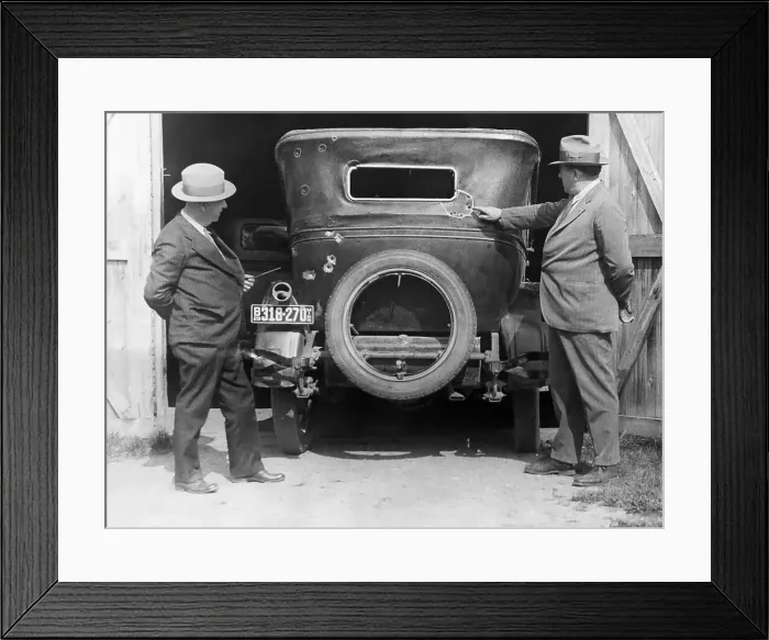 Framed Print : Man Pointing To Holes In Car Framed Print : Man Pointing To Holes In Car