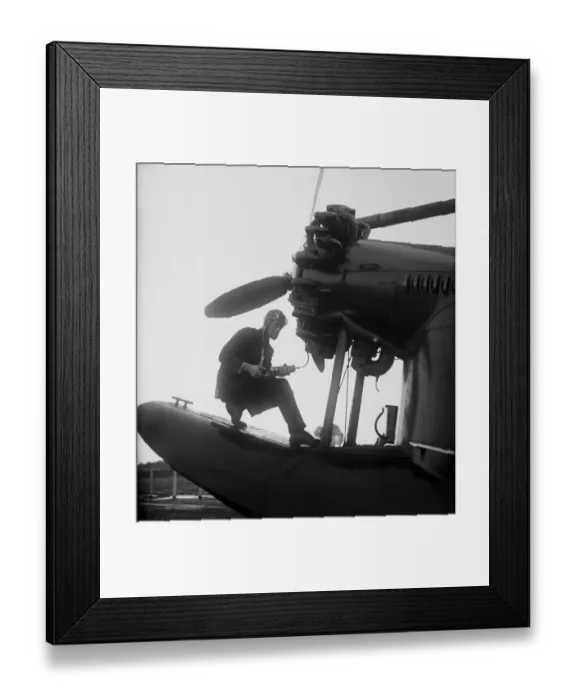 Framed Print : Charles Lindbergh Working on Plane