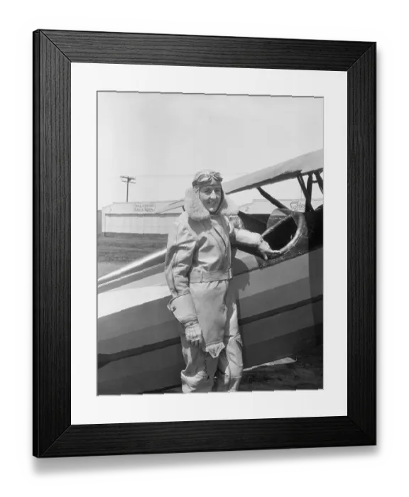 Framed Print : Bobbie Trout Posing Next to an Airplane Framed Print : Bobbie Trout Posing Next to an Airplane