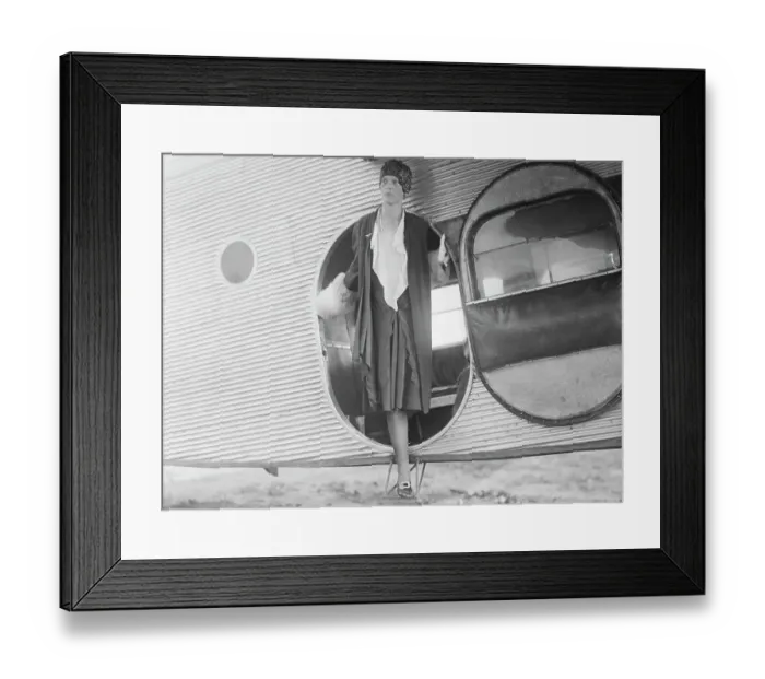 Framed Print : Amelia Earhart Standing in Airplane Doorway Framed Print : Amelia Earhart Standing in Airplane Doorway