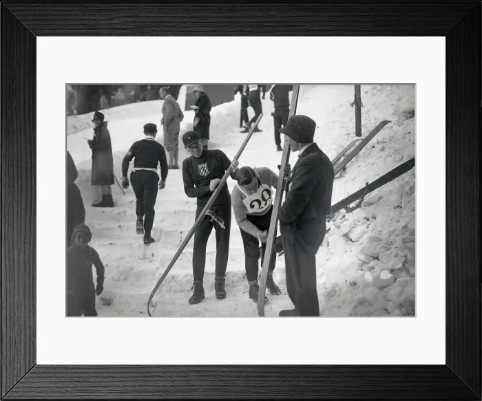 Framed Print : Rolf Munsen Adjusting Skis at Winter Games in Moritz