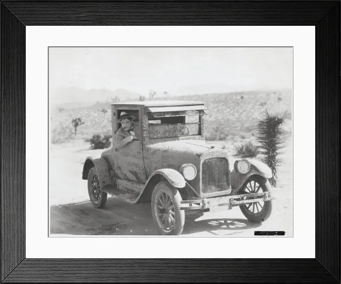 Framed Print : Man Driving Mud-Splattered Car Framed Print : Man Driving Mud-Splattered Car