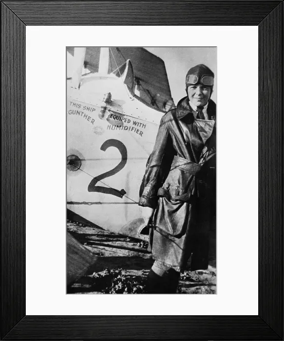 Framed Print : Miss Amelia Earhart Posing with Airplane Framed Print : Miss Amelia Earhart Posing with Airplane