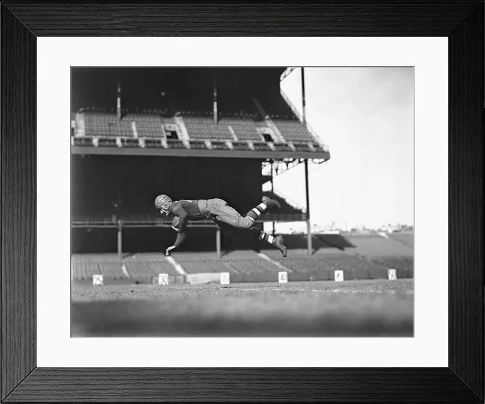 Framed Print : Red Grange Jumping in Air