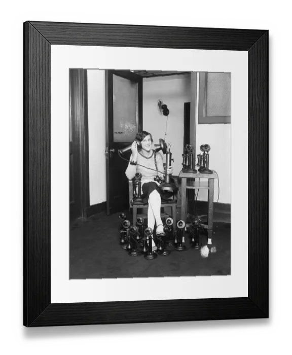 Framed Print : Woman Sitting With Many Phones Framed Print : Woman Sitting With Many Phones