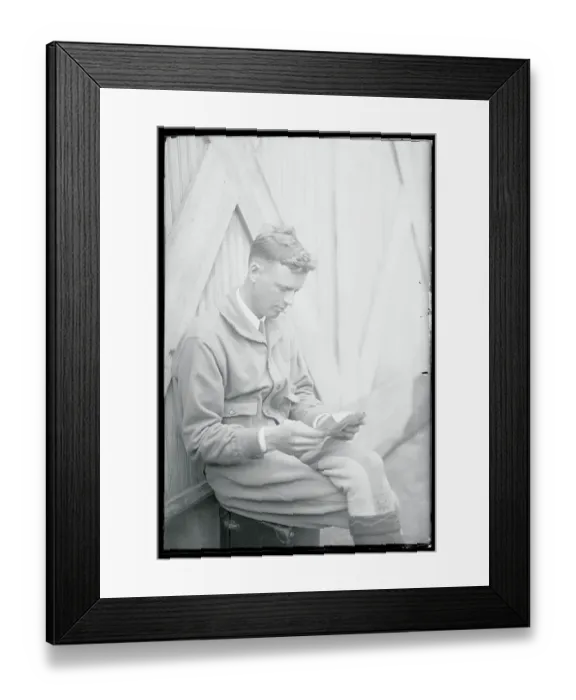 Framed Print : Charles Lindbergh Sitting and Reading Mail