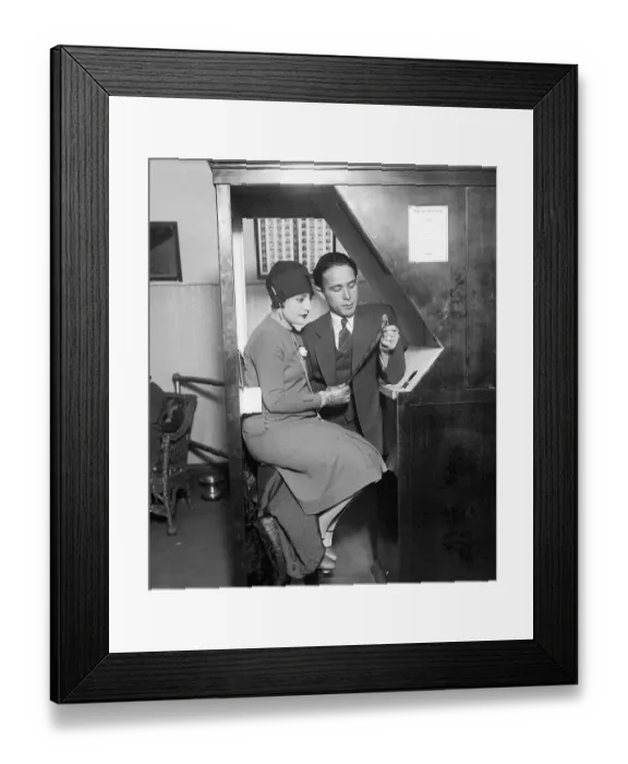 Framed Print : Mr. and Mrs. Anatol Josepho Looking at Photo Strip Framed Print : Mr. and Mrs. Anatol Josepho Looking at Photo Strip