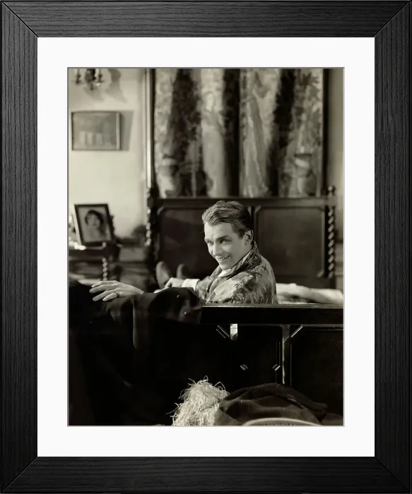 Framed Print : Douglas Fairbanks in Costume on Bed Framed Print : Douglas Fairbanks in Costume on Bed