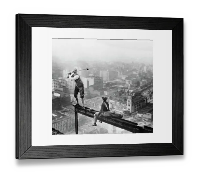 Framed Print : Golfer Teeing Off on Girder High Above City Framed Print : Golfer Teeing Off on Girder High Above City
