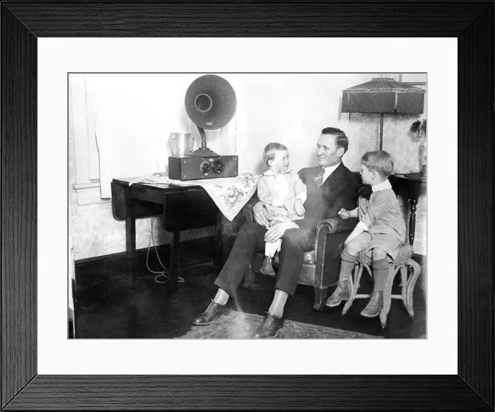 Framed Print : Children and Their Dad at Home Listening to Radio Framed Print : Children and Their Dad at Home Listening to Radio