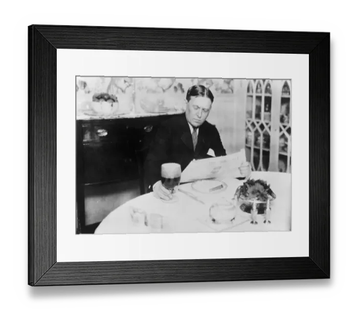Framed Print : Journalist H.L. Mencken Reading Newspaper at Dining Table Framed Print : Journalist H.L. Mencken Reading Newspaper at Dining Table