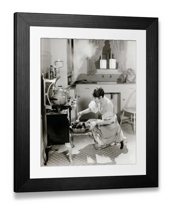 Framed Print : Woman Cooking In Kitchen At Stove Framed Print : Woman Cooking In Kitchen At Stove