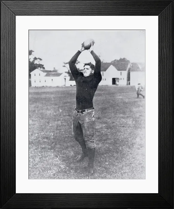 Framed Print : Football Player Holding Ball