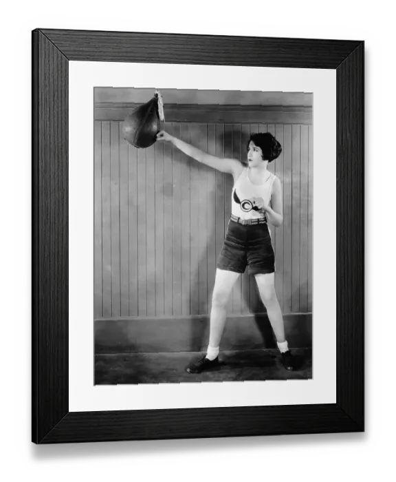 Framed Print : Woman Hitting Punching Bag; Boxing Outfi Framed Print : Woman Hitting Punching Bag; Boxing Outfi