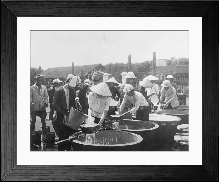 Framed Print : People Pouring Rubber Sap into Tanks Framed Print : People Pouring Rubber Sap into Tanks