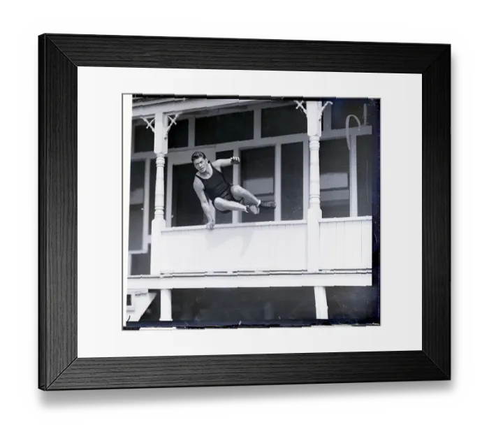 Framed Print : Gene Tunney Leaping Over Porch Wall Framed Print : Gene Tunney Leaping Over Porch Wall