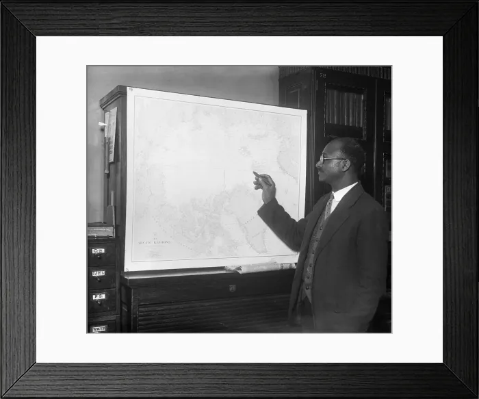 Framed Print : Matt Henson Looking At A Map Framed Print : Matt Henson Looking At A Map