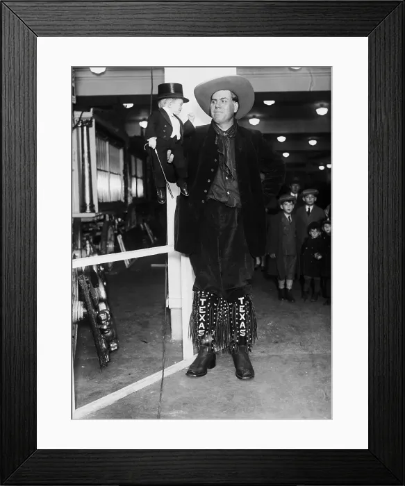 Framed Print : Giant Holding Midget In Hand Framed Print : Giant Holding Midget In Hand