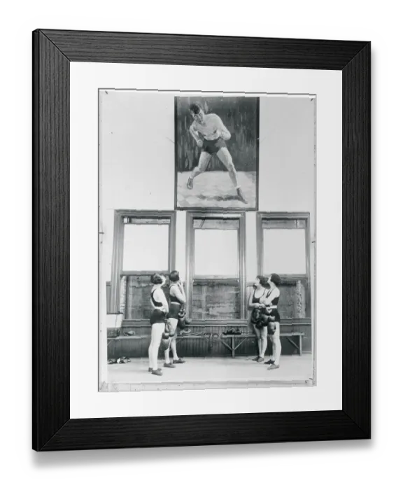Framed Print : Female Boxers Looking at Portrait of Jack Dempsey Framed Print : Female Boxers Looking at Portrait of Jack Dempsey