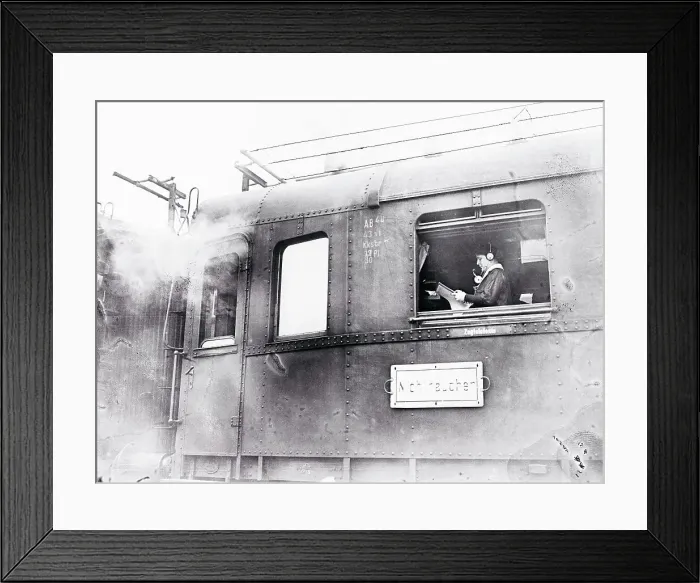 Framed Print : Man Using a Telephone in a Train Framed Print : Man Using a Telephone in a Train