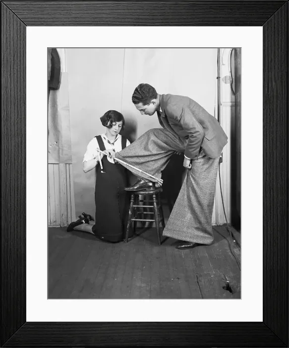 Framed Print : Woman Has Wide-Cuffs Of Trousers Measure Framed Print : Woman Has Wide-Cuffs Of Trousers Measure