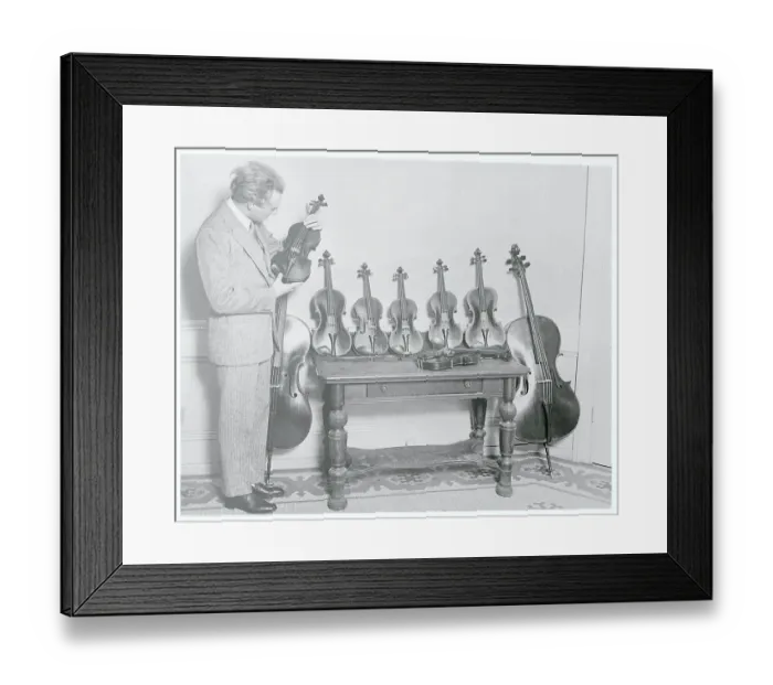 Framed Print : Leopold Stokowski Inspecting Rare Violins Framed Print : Leopold Stokowski Inspecting Rare Violins